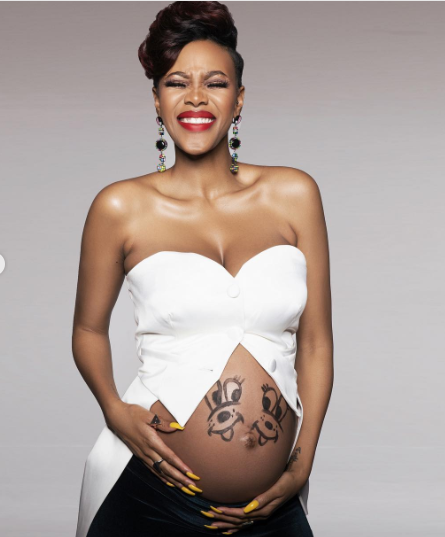 Luthando 'LootLove' Shosa carrying her twins affectionately known as "hip" and "hop".