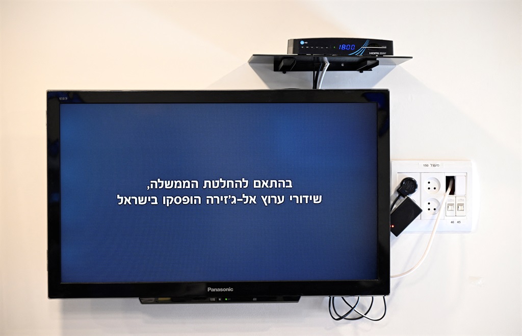 A message seen on a television screen in Jerusalem on 5 May 2024, which translates as: "In accordance with the government decision, Al Jazeera channel broadcasts have been suspended in Israel." (RONALDO SCHEMIDT / AFP)