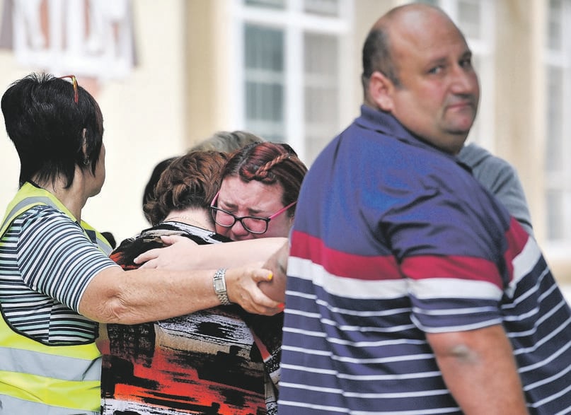 Family members mourn the loss of their loved ones at Hoërskool Driehoek in Vanderbijlpark where three pupils died on Friday. Picture: Rosetta Msimango/City Press