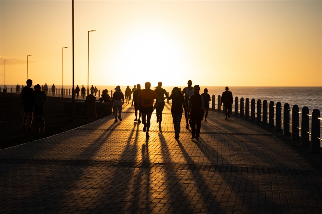 Sunset before lockdown along the Sea Point Promenade. The writer says she believes there is light at the end of the Covid-19 tunnel.