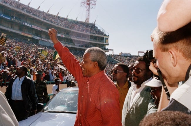 Supporters come out to greet ANC leader Nelson Mandela at his last rally before casting his vote during SA's first democratic elections at the FNB stadium on 25 April 1994 in Soweto. Dubbed by many #2024isOur1994, the 2024 national and provincial elections are expected to be a watershed moment. 