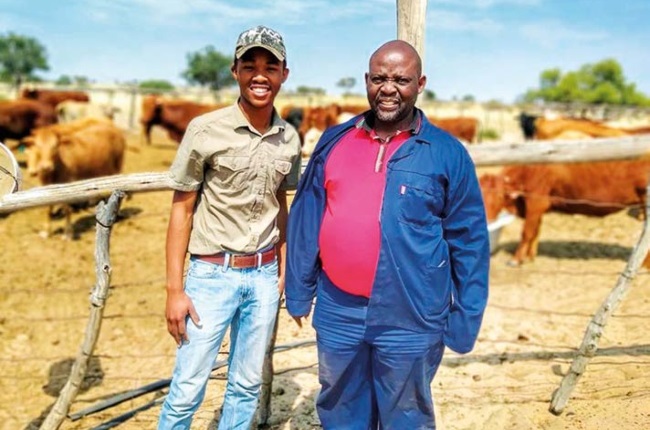 Thabo with his dad, Pushoetsile. The Dithakgwes became the proud owners of Constable Farm after the family won a land claim under Barolong Boo Maiketso Communal Property Association from the government in 2015, allowing them to farm there for 30 years.