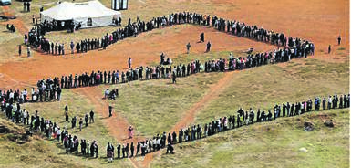 People queue to cast their votes in 1994