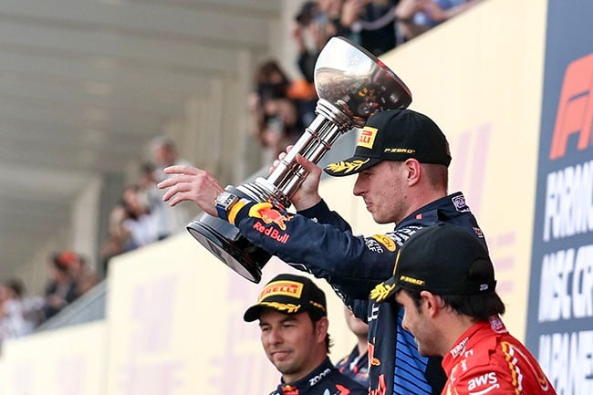 Max Verstappen celebrates his win on the podium after the Japanese Grand Prix at Suzuka International Racing Course on 7 April 2024. (Qian Jun/MB Media/Getty Images)