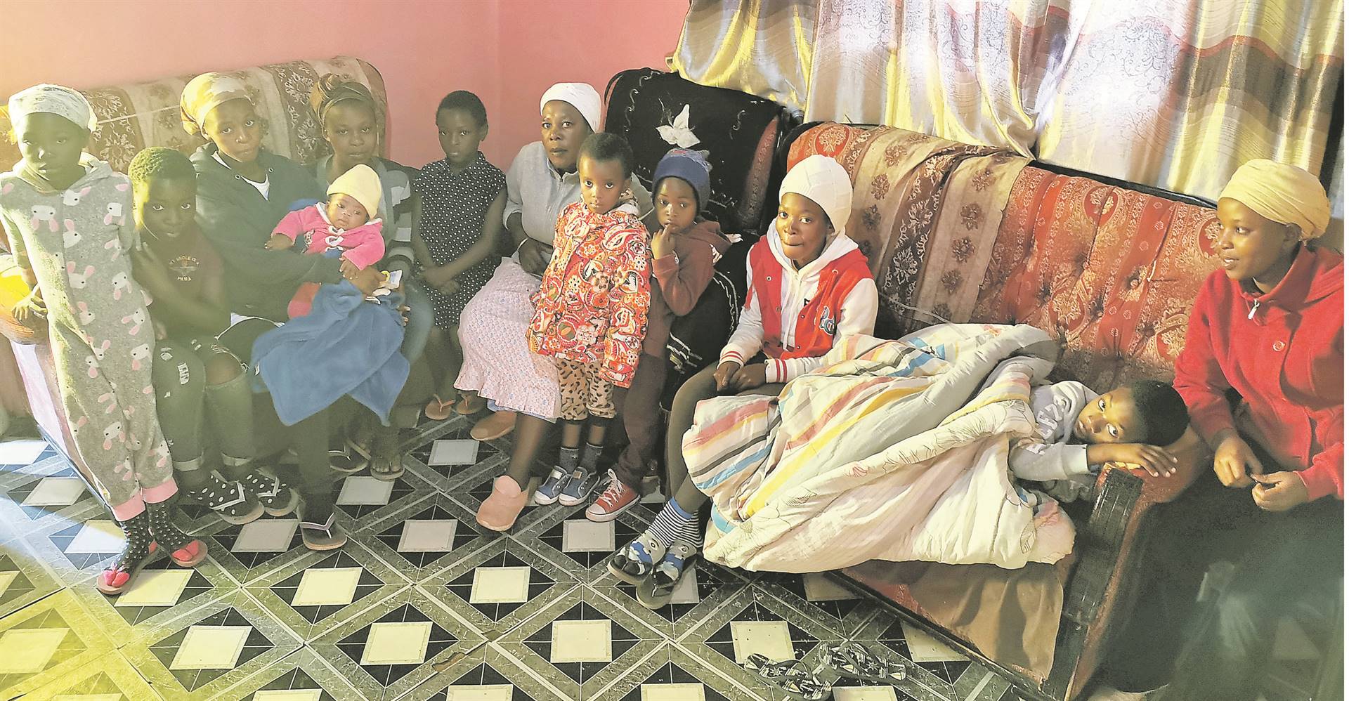 Nosapho Dukada (centre) with some of her children and grandchildren at their home in New Rest in Qokolweni near Mthatha. Picture: Lubabalo Ngcukana/City Press