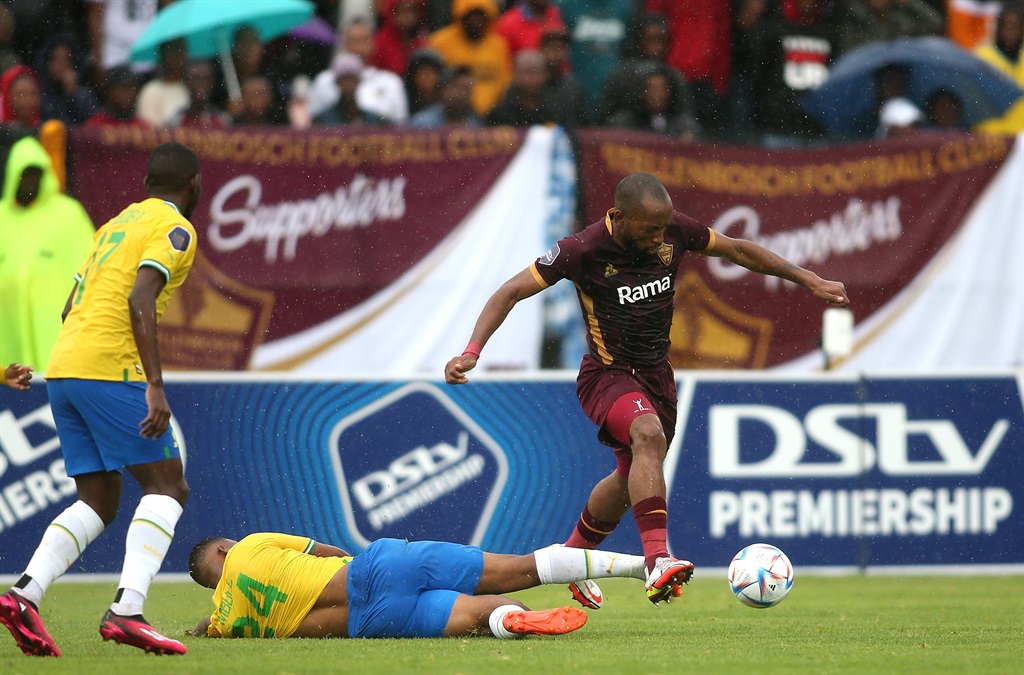 Sipho Mbule of Mamelodi Sundowns tackles Sibongiseni Mthethwa of Stellenbosch FC during the DStv Premiership 2022/23 match.