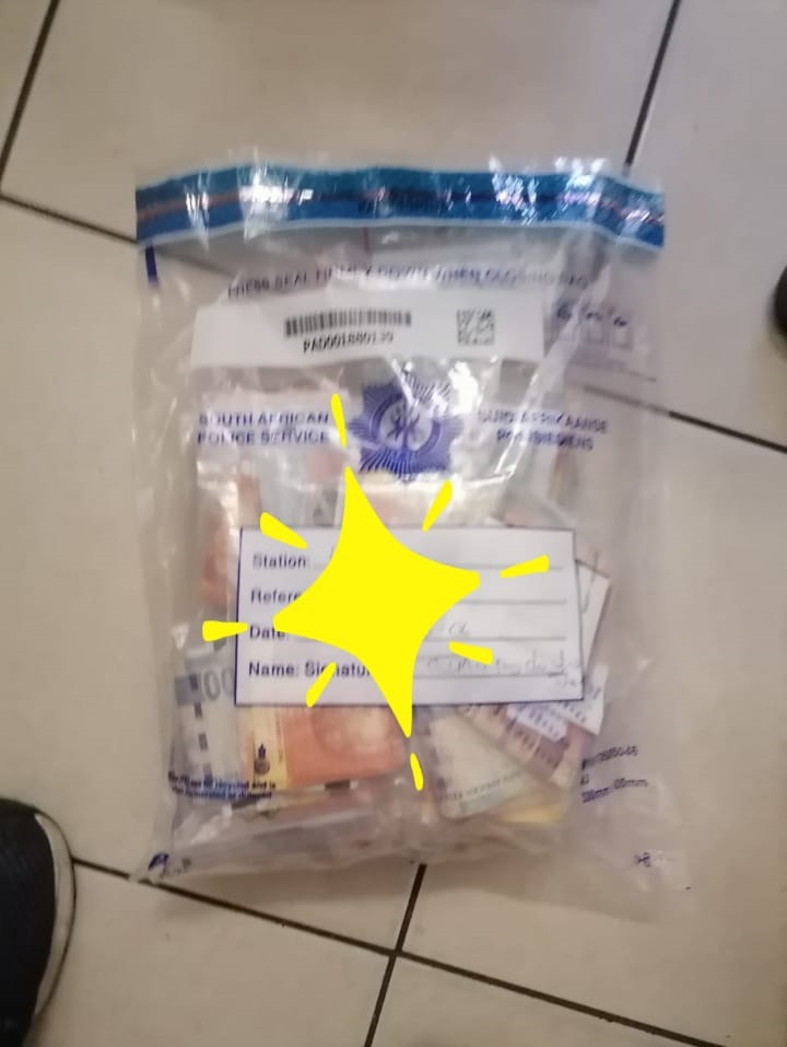 Two suspects were nabbed  with cash after allegedly going to the ATM's with a number of cards and making numerous withdrawals. Photo Supplied
