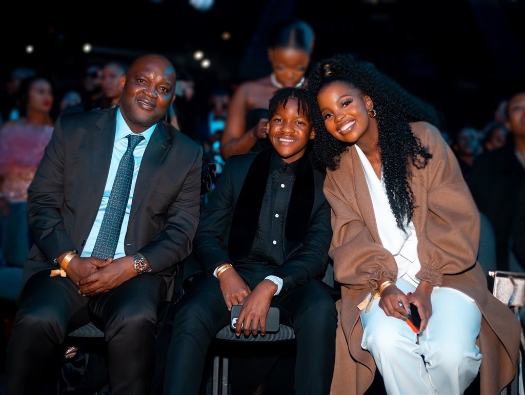 Pitso Mosimane with 2/3 of his children.