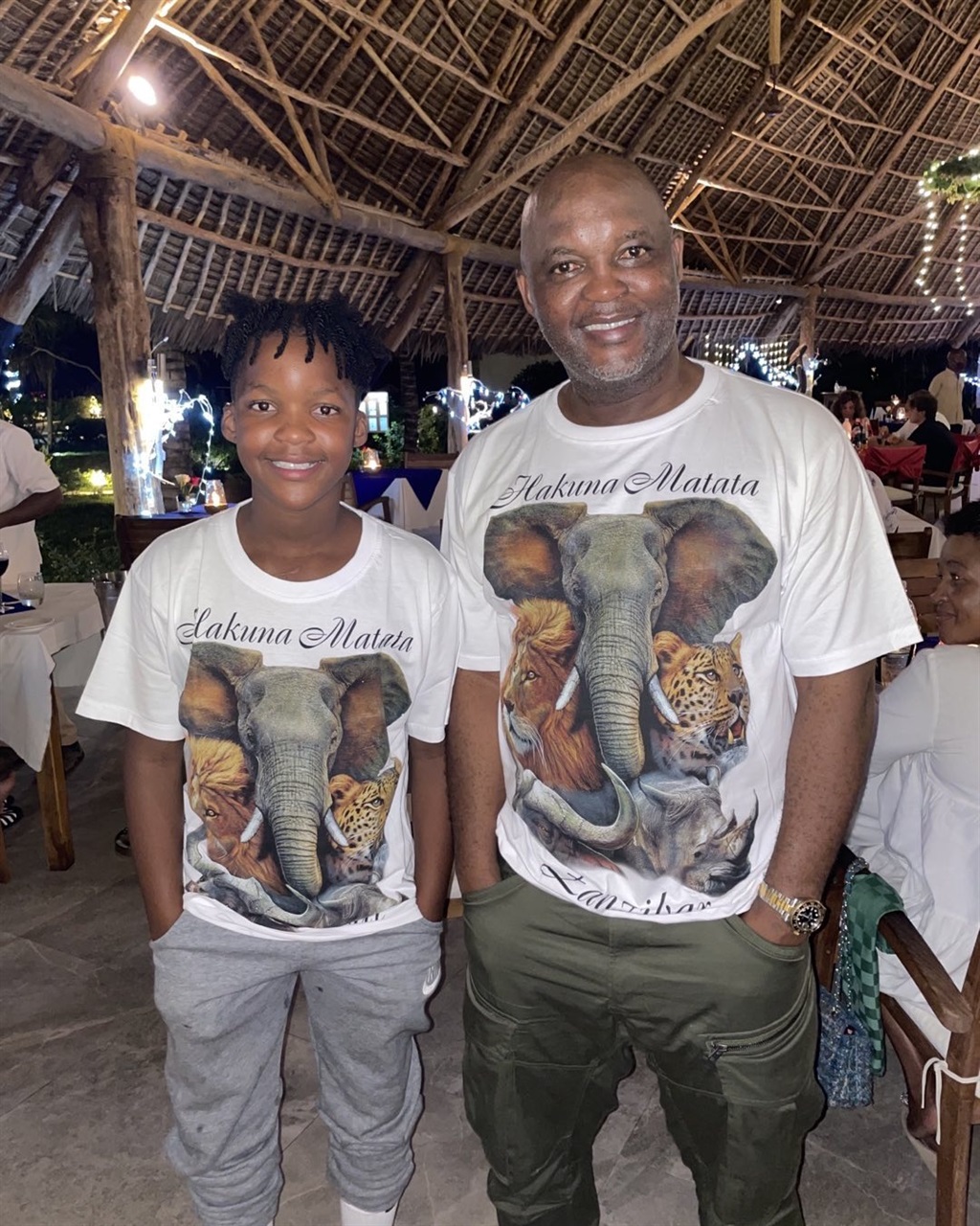 Pitso Mosimane alongside his youngest son.