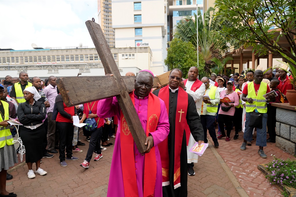 Archbishop of Nairobi Philip Anyolo, carries a woo