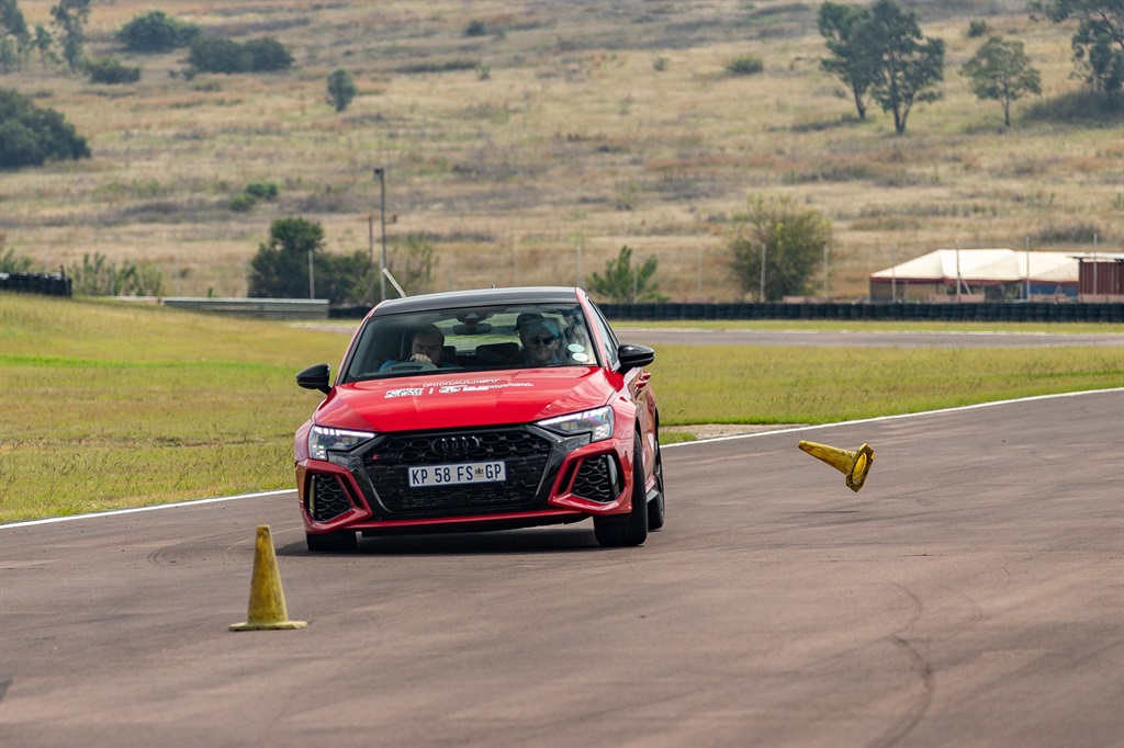 A jury member takes the Audi RS 3 Sportabck through the slalom test at Zwartkops Raceway for the 2023 Car of the Year competition. (Chris Wall)
