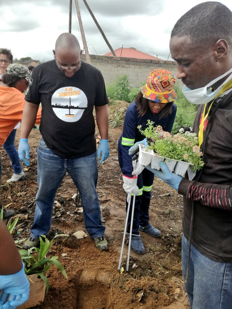 Resident cleaning Lenasia South dumpsites and turning them into gardens. 
