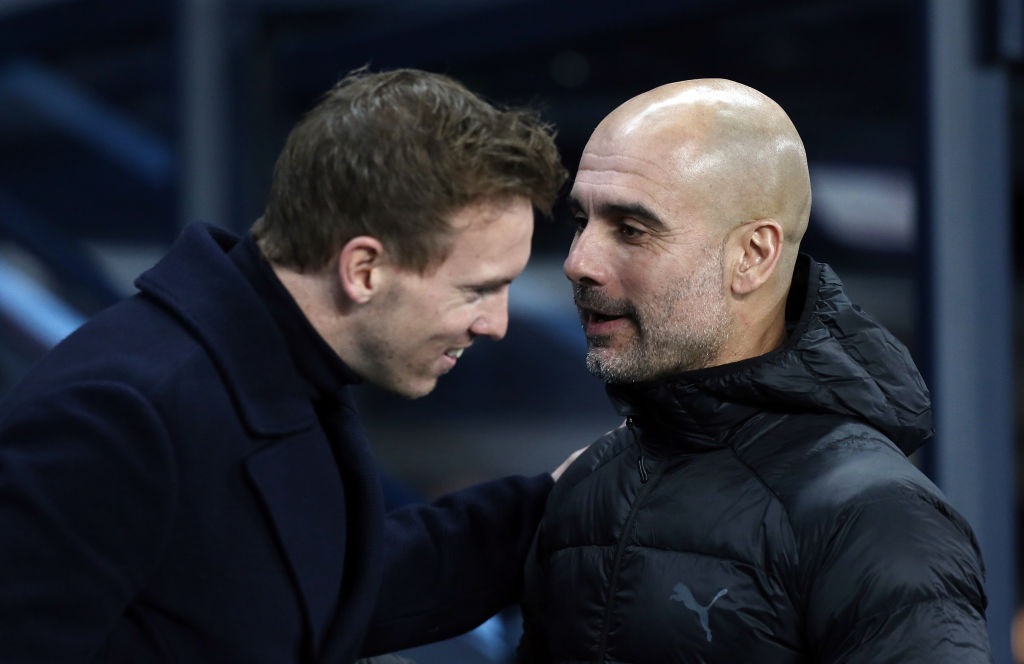 MANCHESTER, ENGLAND - DECEMBER 12:  1899 Hoffenheim manager Julian Nagelsmann (left) is greeted by Manchester City manager Josep Guardiola ahead of kick-off during the UEFA Champions League Group F match between Manchester City and TSG 1899 Hoffenheim at Etihad Stadium on December 12, 2018 in Manchester, United Kingdom. (Photo by Rich Linley - CameraSport via Getty Images)