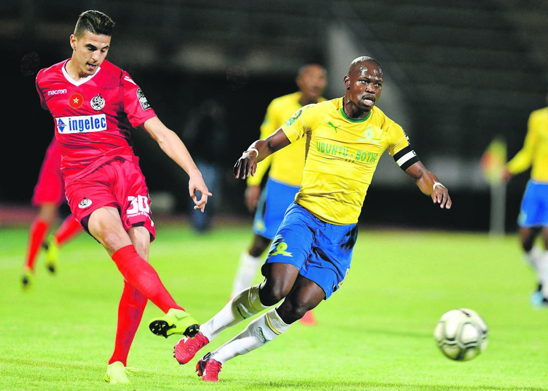 Hlompho Kekana and his team are hoping to solve their clash of fixtures. The Downs captain is seen here with Mohammed Nahiri of Wydad Athletic. Picture: Lefty Shivambu / Gallo Images