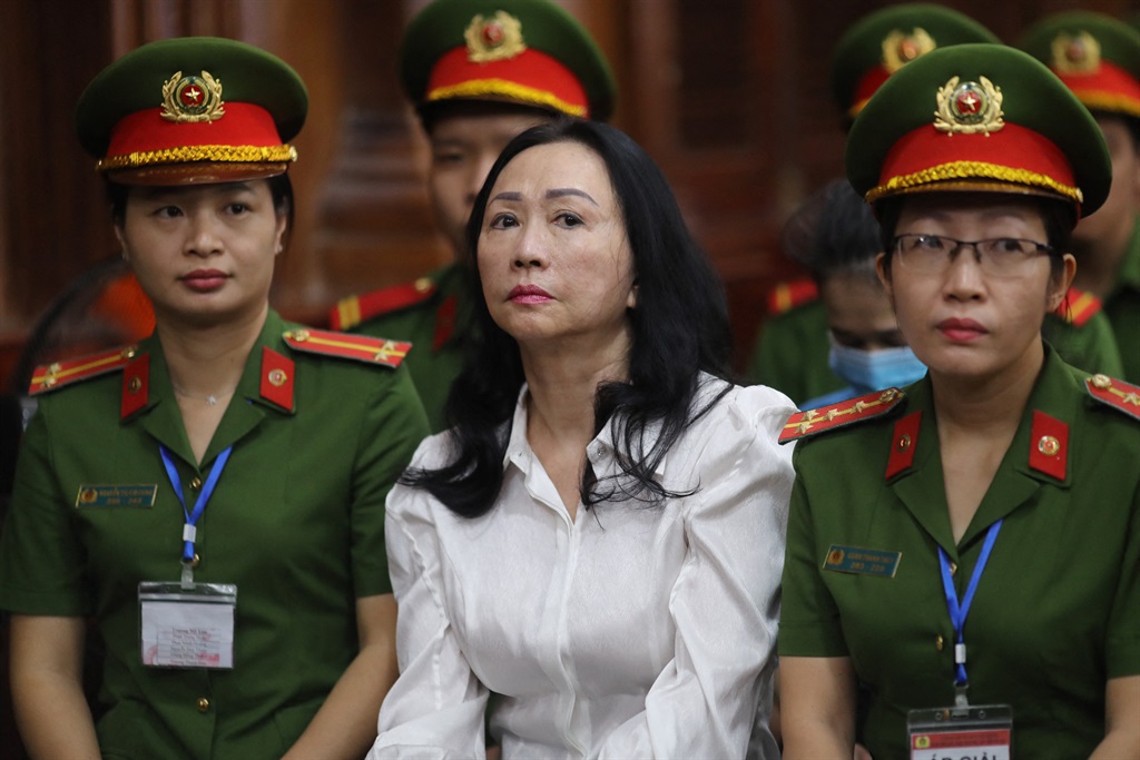Vietnamese property tycoon Truong My Lan (C) looks on at a court in Ho Chi Minh city on April 11, 2024. A top Vietnamese property tycoon could face the death penalty when she and dozens of other co-accused face verdicts on April 11 in one of the country's biggest fraud cases over the embezzlement of $12.5 billion. (STR/AFP)