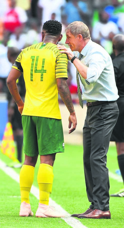 EAR CANDY . . . Bafana Bafana coach Stuart Baxter has a word with his captain Thulani Hlatshwayo. Photo by Gallo Images. 