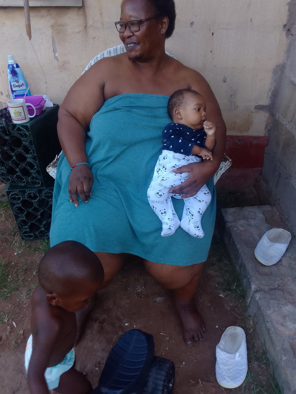 Lindeni Ndlovu, 59, photographed with baby Lwazi a