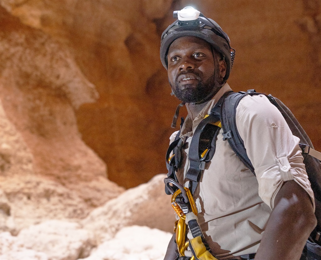 Dwayne Fields poses in a cave. (Photo: National Geographic/Harry Palmer)