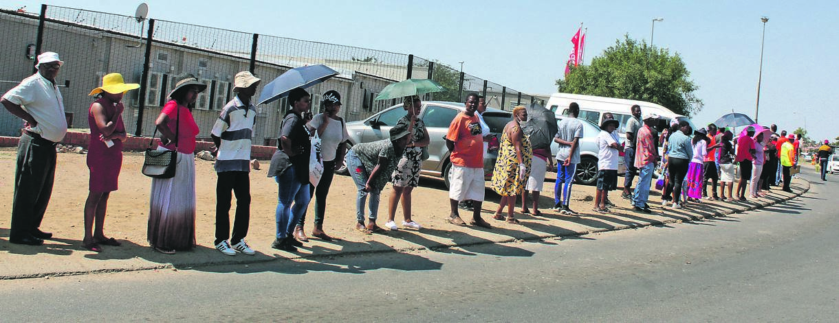 Long queues and social distancing remains a challenge for social grant beneficiaries.       Photo by Phuti Raletjena