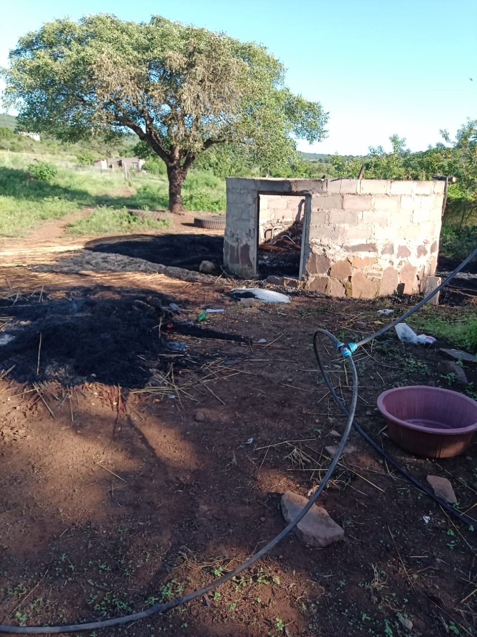 The rondavel that was set alight by villagers.