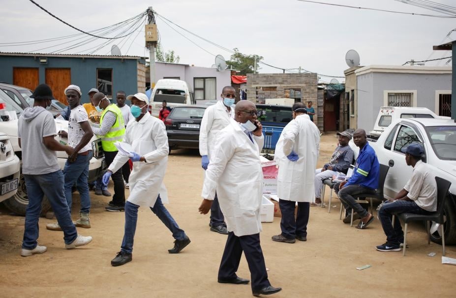Members of the medical staff screen residents for the Covid-19 coronavirus in Alexandra. Picture: Siphiwe Sibeko/Reuters