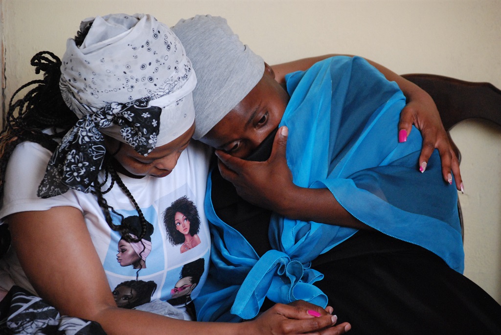 Sisters Noluthando Motaung and Sibongile Moagi could not contain their grief. Photo by Khaya Masipa