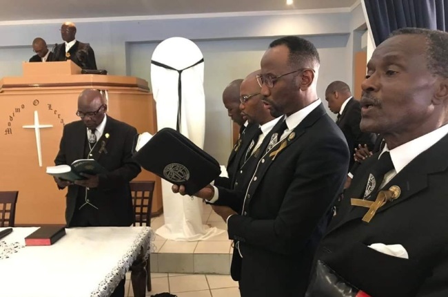 Lesley Mofokeng is a member of the men’s ministry of his church. He is seen here singing from the Hosanna hymnbook of the NG Kerk, now used in the URCSA, at his home congregation of Alexandra, Johannesburg. PHOTO: FAMILY ALBUM