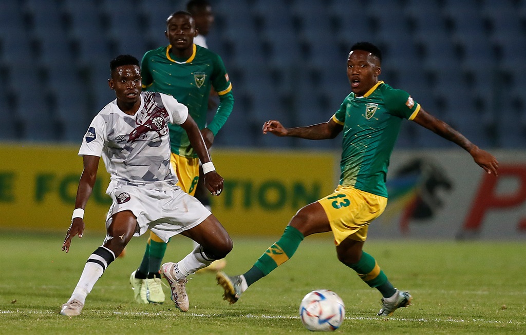 JOHANNESBURG, SOUTH AFRICA - MARCH 17: Lindokuhle Mtsali of Swallows FC in action with Pule Mmodi of Golden Arrows during the DStv Premiership match between Swallows FC and Golden Arrows at Dobsonville Stadium on March 17, 2023 in Johannesburg, South Africa. (Photo by Gallo Images)