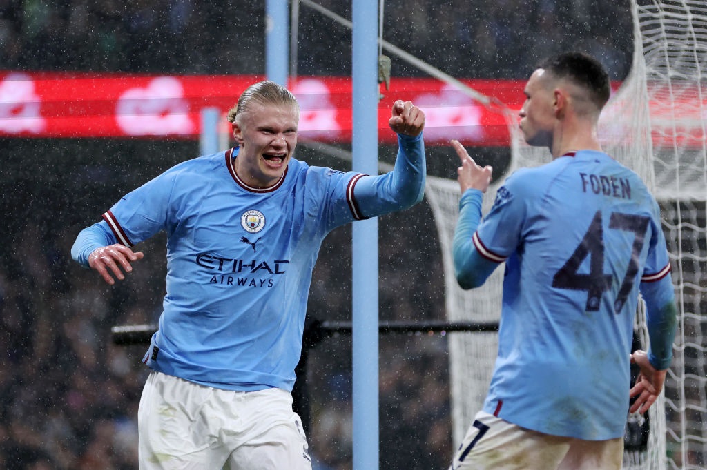 MANCHESTER, ENGLAND - MARCH 18: Erling Haaland of Manchester City celebrates with teammate Phil Foden after scoring the teams second goal during the Emirates FA Cup Quarter Final match between Manchester City and Burnley at Etihad Stadium on March 18, 2023 in Manchester, England. (Photo by Clive Brunskill/Getty Images)