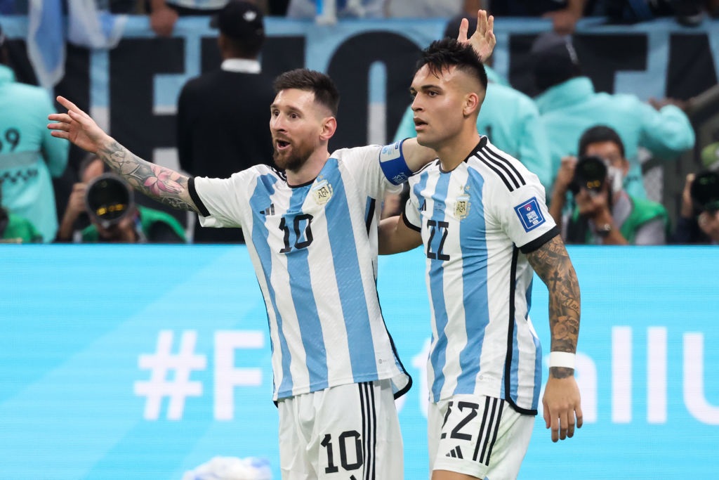 LUSAIL CITY, QATAR - DECEMBER 18: Lionel Messi #10 of Argentina celebrates his second goal with Lautaro Martinez #22 of Argentina during the FIFA World Cup Qatar 2022 Final match between Argentina and France at Lusail Stadium on December 18, 2022 in Lusail City, Qatar. (Photo by Zhizhao Wu/Getty Images)