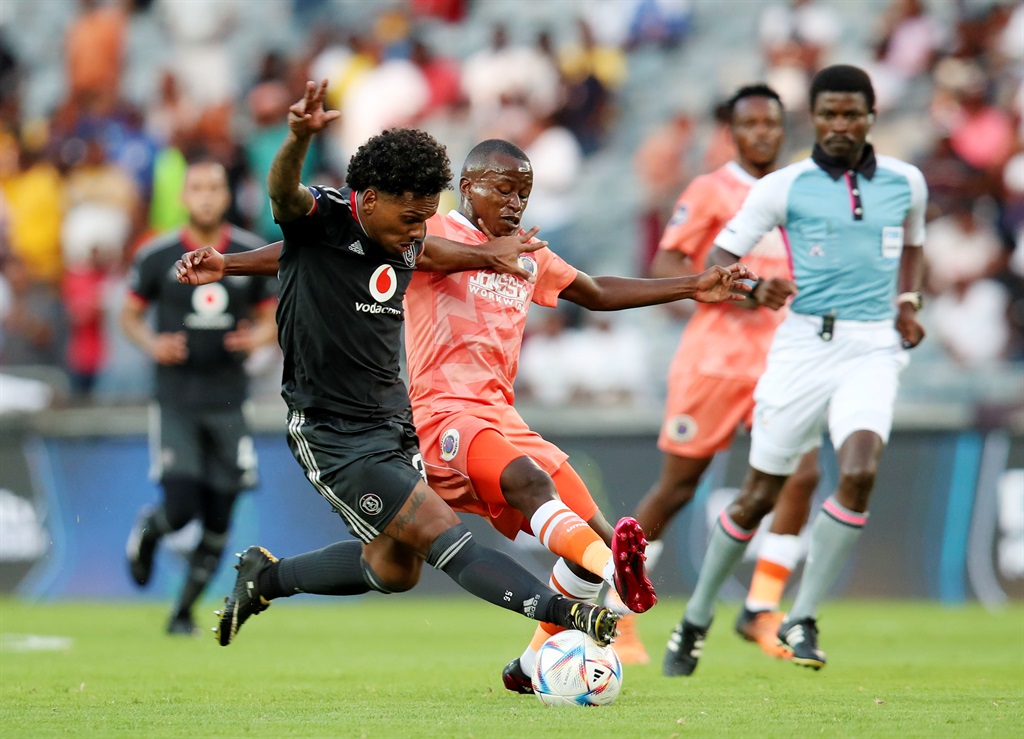 Kermit Erasmus of Orlando Pirates challenged by Siphesihle Ndlovu of SuperSport United during the DStv Premiership 2022/23 match between Orlando Pirates and SuperSport United at the Orlando Stadium, Soweto on 18 March 2023 