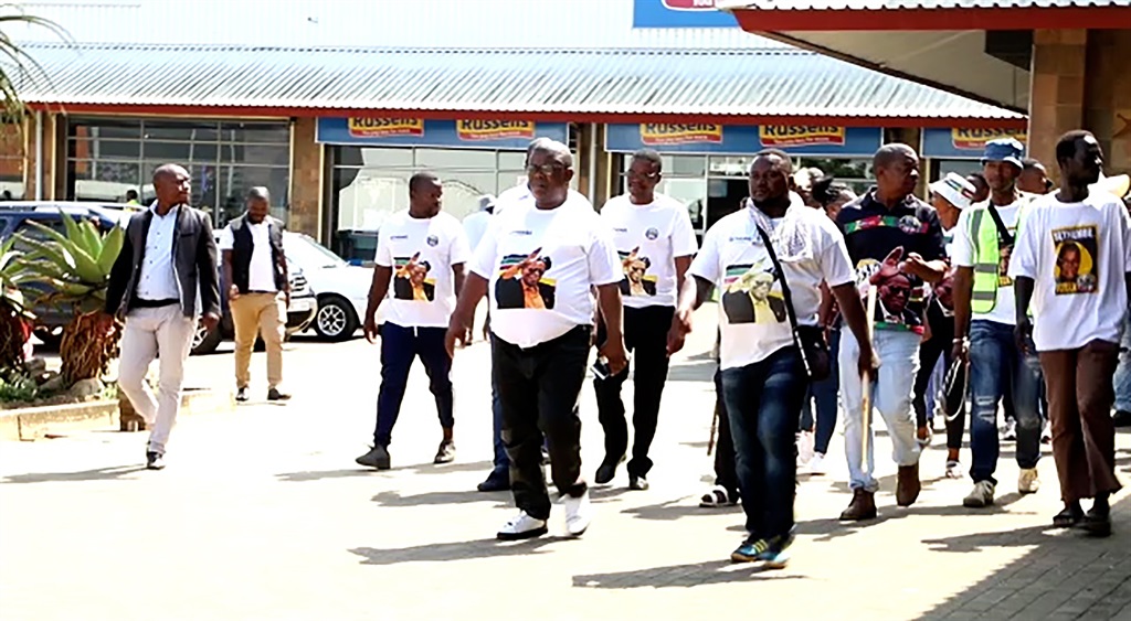 The members of Inkatha Freedom Party led by Ulundi Municipality Mayor Wilson Ntshangase patrolling around the business centre in Ulundi to ensure that no business is interrupted. 