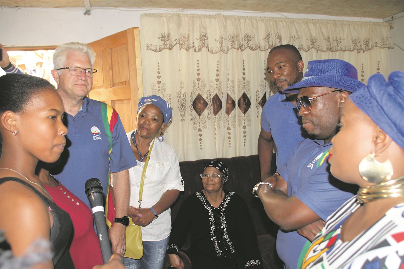 DA leader Mmusi Maimane, with Western Cape premier candidate Alan Winde and other leaders speak to prospective voters in Mitchells Plain. Picture: Lindile Mbontsi
