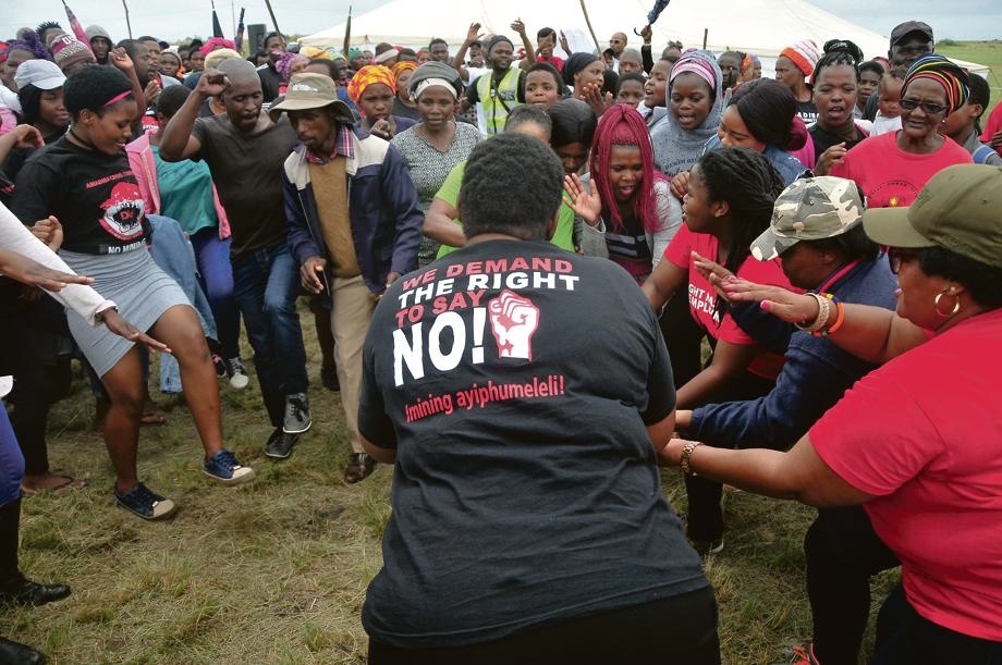 Members of the Amadiba Crisis Committee sing songs of defiance during a Human Rights Day rally to commemorate their slain comrade Siphesihle ‘Bazooka’ Rhadebe. Pictures: Lucas Ledwaba