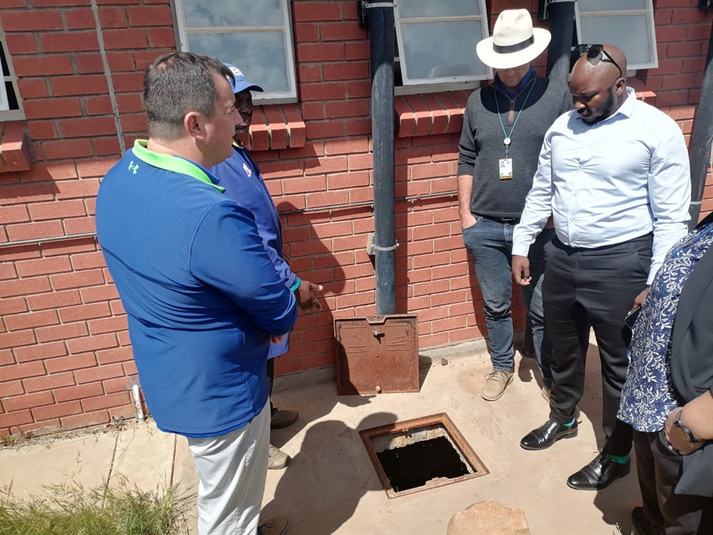 Glen Grey Primary School caretaker showing members of Parliament where the body of Langalam Viki was found.