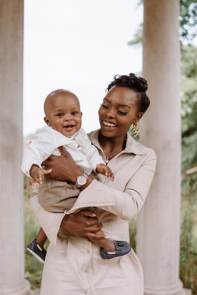 black mother holding her infant son
