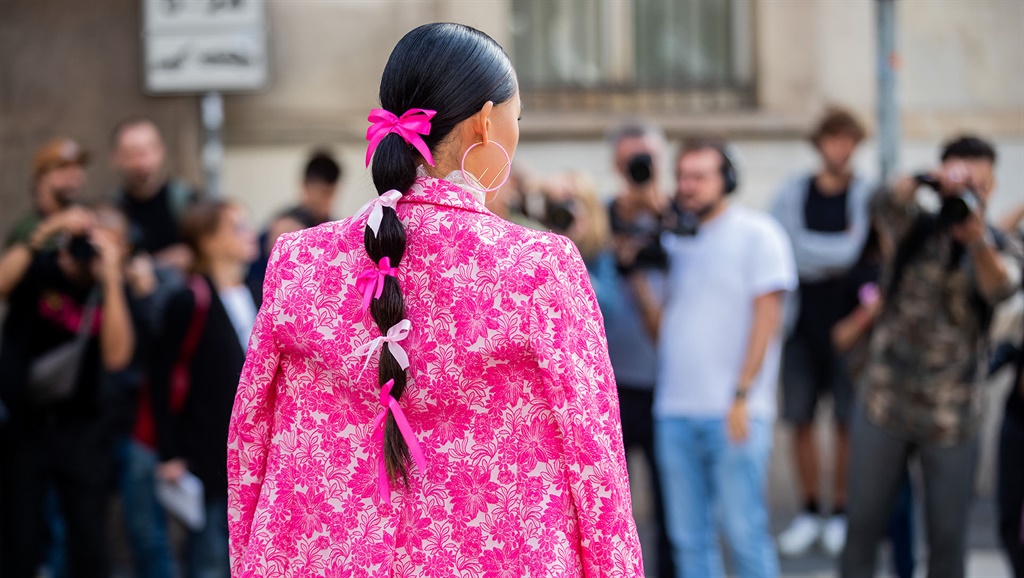 Jaime Xie seen with bows in her hair at fashion week. (Photo by Christian Vierig/Getty Images)