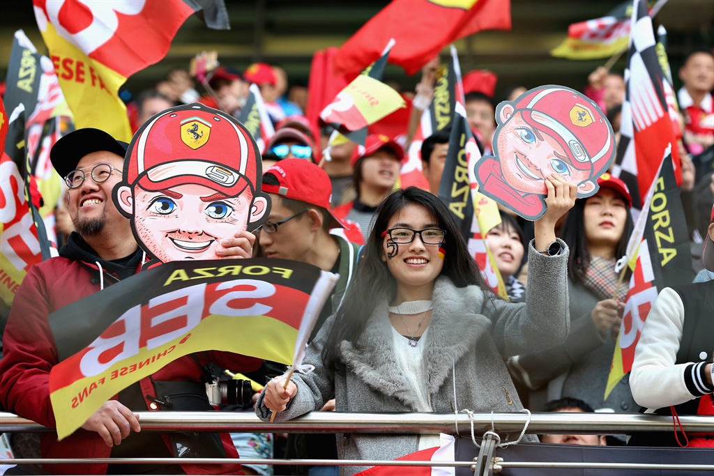 Sebastian Vettel of Germany and Ferrari fans get excited before the Formula One Grand Prix of China at Shanghai International Circuit on April 15, 2018. Picture: Lintao Zhang/Getty Images
