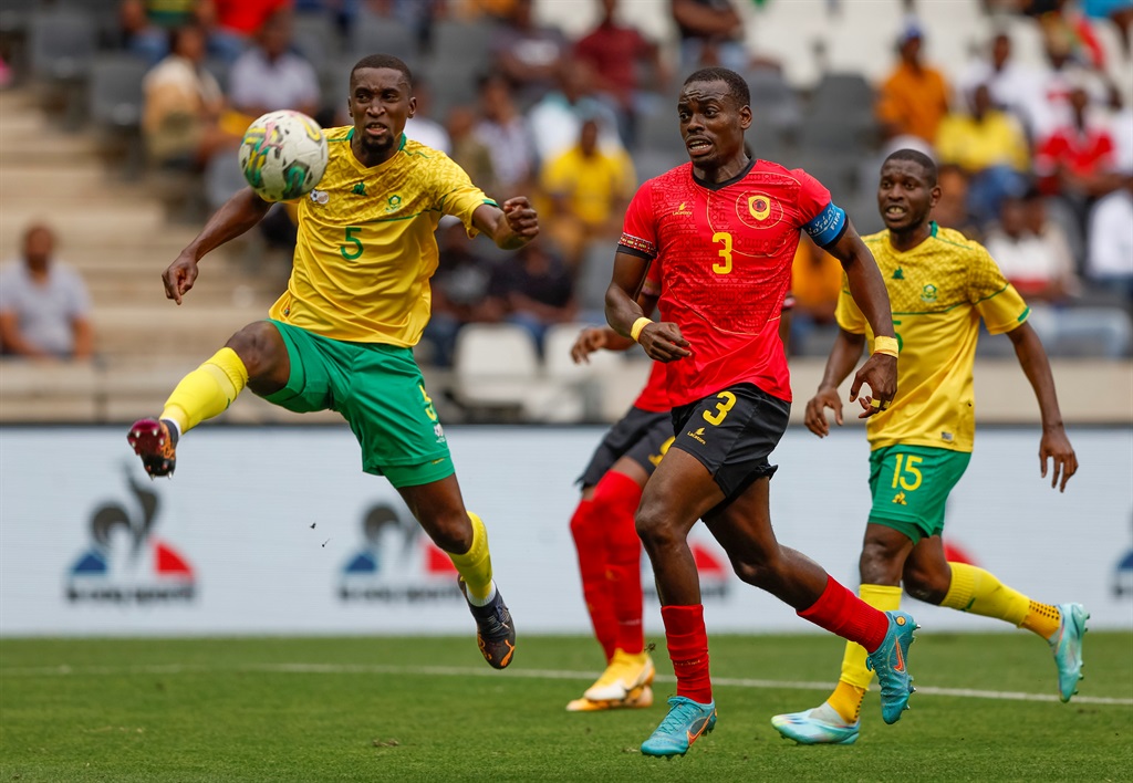 NELSPRUIT, SOUTH AFRICA - NOVEMBER 20: Siyanda Xulu of South Africa and Buatu Jonathan of Angola during the international friendly match between South Africa and Angola at Mbombela Stadium on November 20, 2022 in Nelspruit, South Africa. (Photo by Dirk Kotze/Gallo Images)