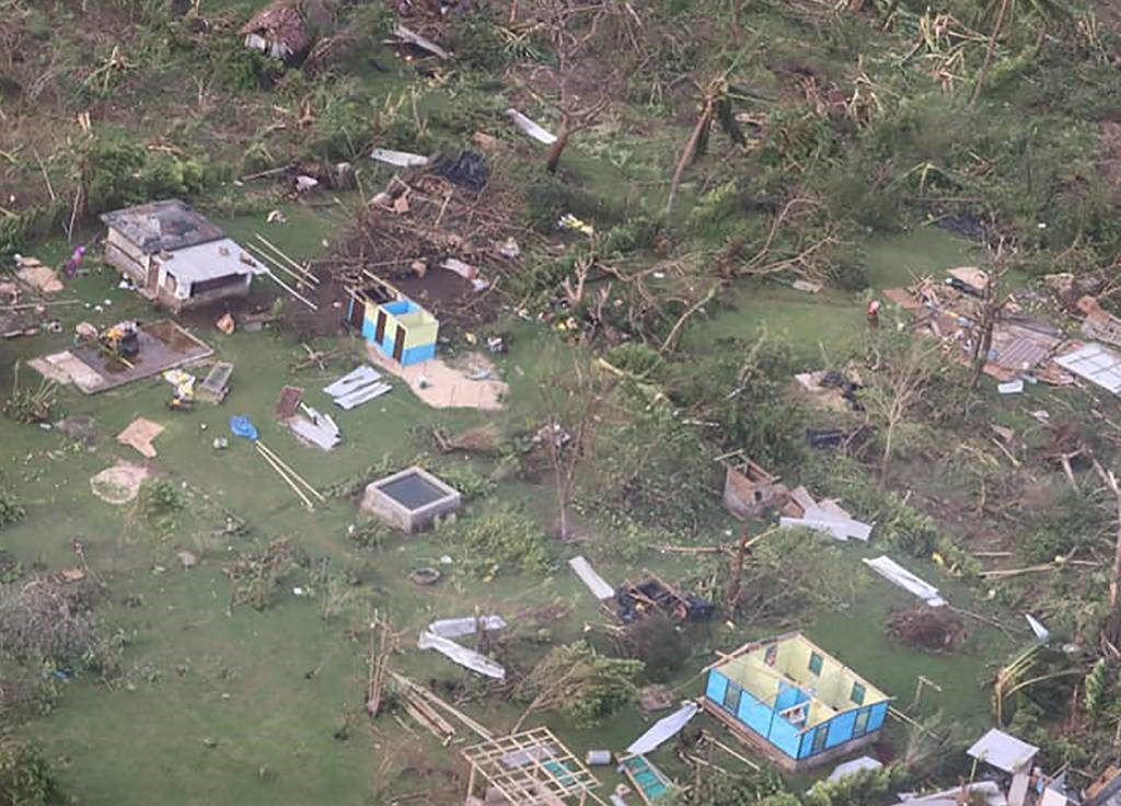 This aerial handout photo taken by the International Federation of Red Cross Pacific shows damaged houses in the aftermath of Tropical Cyclone Harold on the island of Santo in Vanuatu.