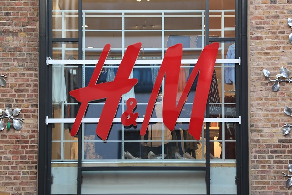 A view of a sign for a H&M clothing retail shop in