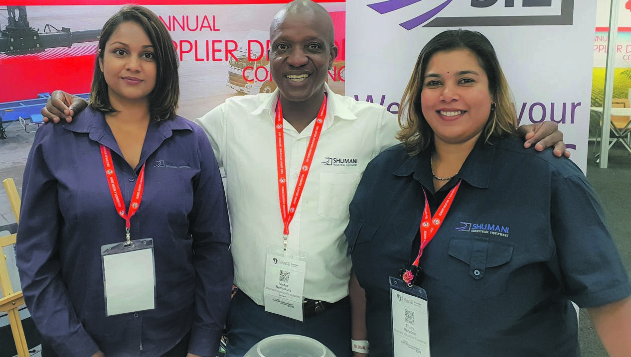 Victor Nemukula (centre), director of Shumani, a Coca-Cola supplier, with staff members at last week’s supplier development conference.