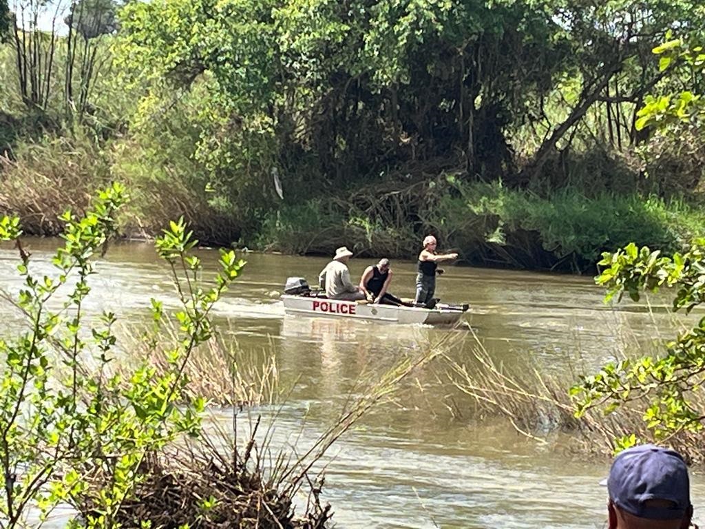 Police retrieve the body of a man who was  allegedly fleeing from an angry mob and drowned. 
