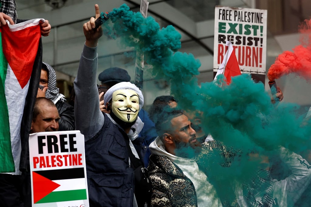 Pro-Palestinian activists and supporters during a demonstration outside the Israeli embassy in central London on 15 May 2021.