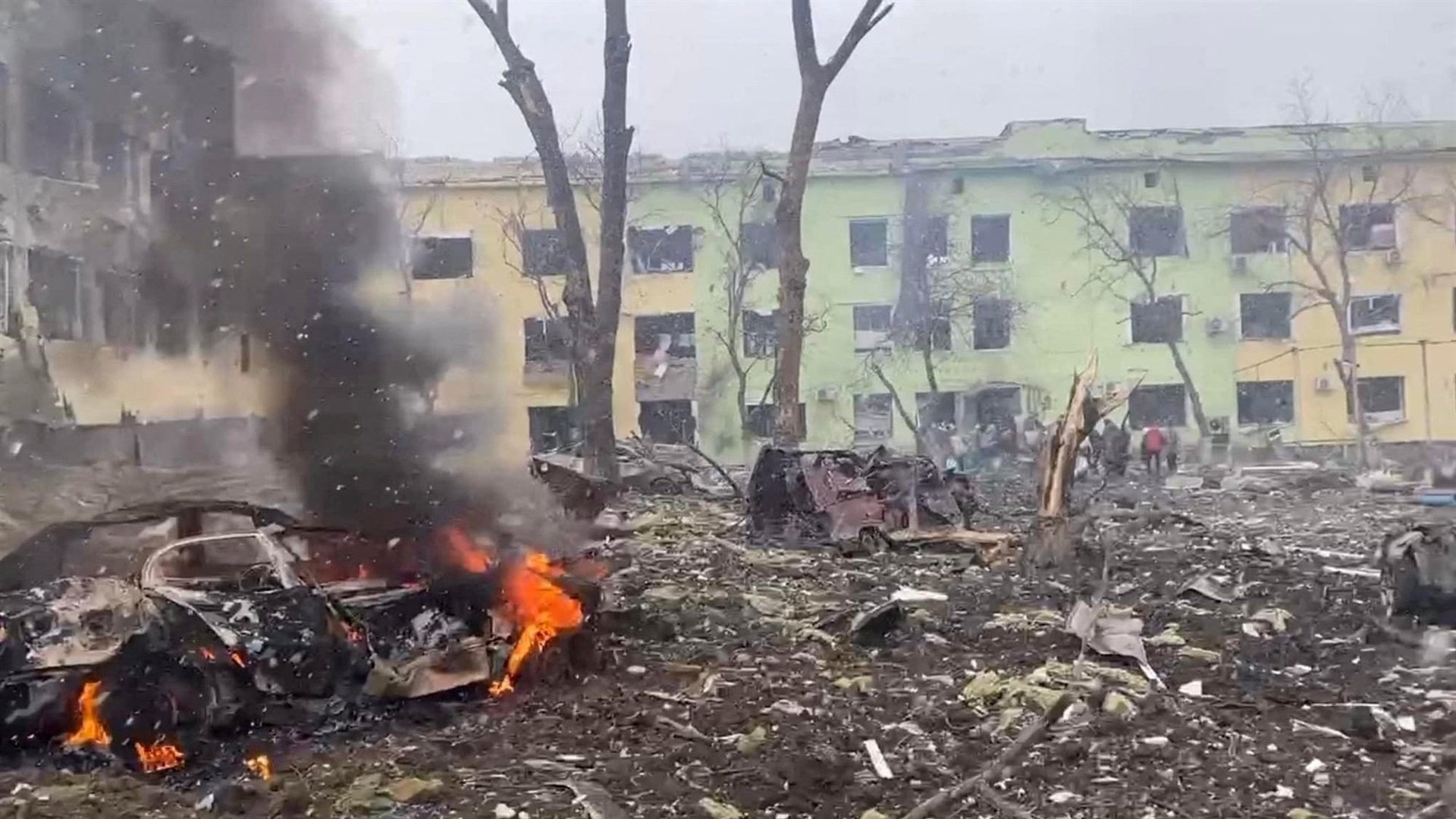 A view shows cars and a building of a hospital destroyed by an aviation strike in Mariupol, Ukraine, in this handout picture released March 9, 2022.