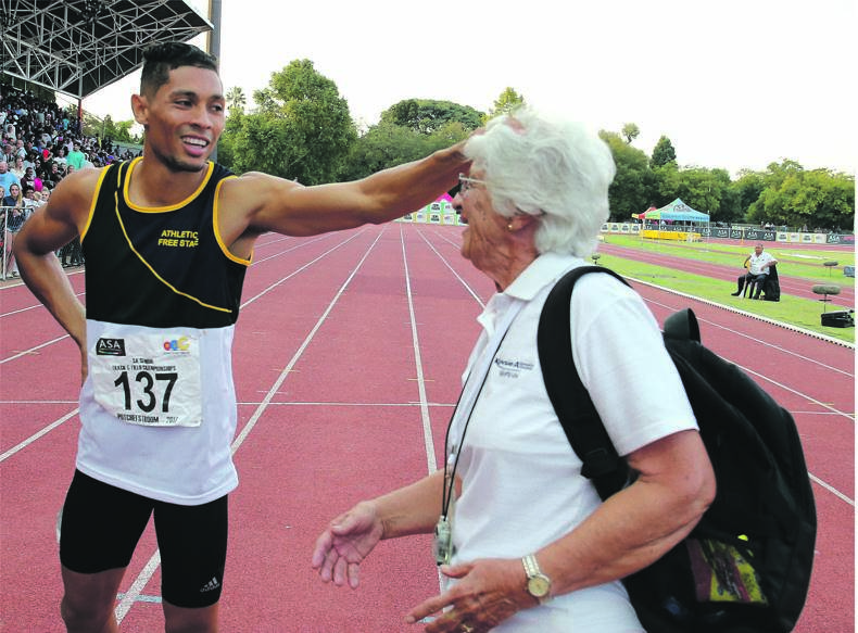 Wayde van Niekerk jokes around with his coach, Tannie Ans Botha, in a light-hearted moment after winning a race two years ago. The sprinter could be back to reclaim his national title at this year’s SA Champs. Picture: Roger Sedres / Gallo Images
