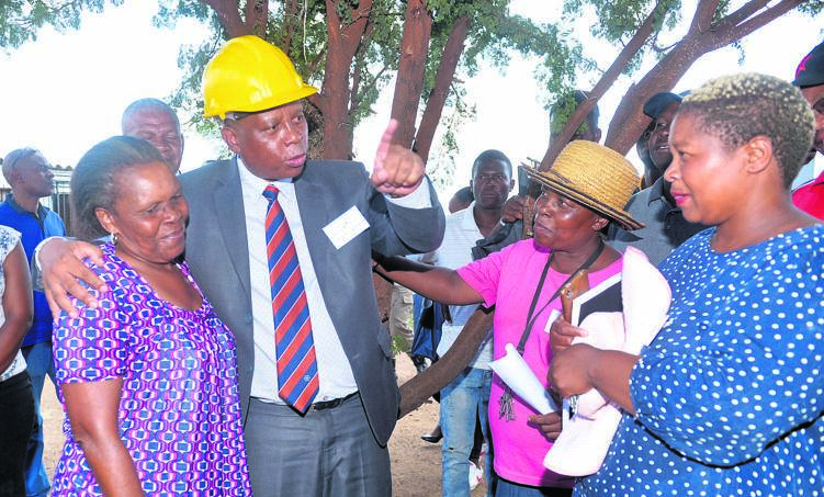 Joburg mayor Herman Mashaba (centre) launched the second phase of an electricity project in Meriting squatter camp yesterday. Photo by Trevor Kunene