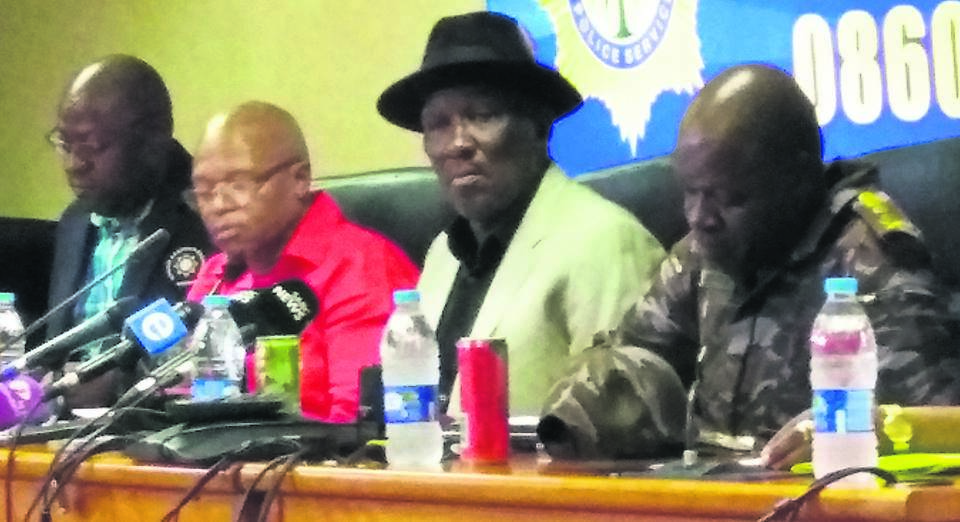 Police Minister Bheki Cele (centre) holds a press conference about a looming strike.            Photo by Sifiso Jimta