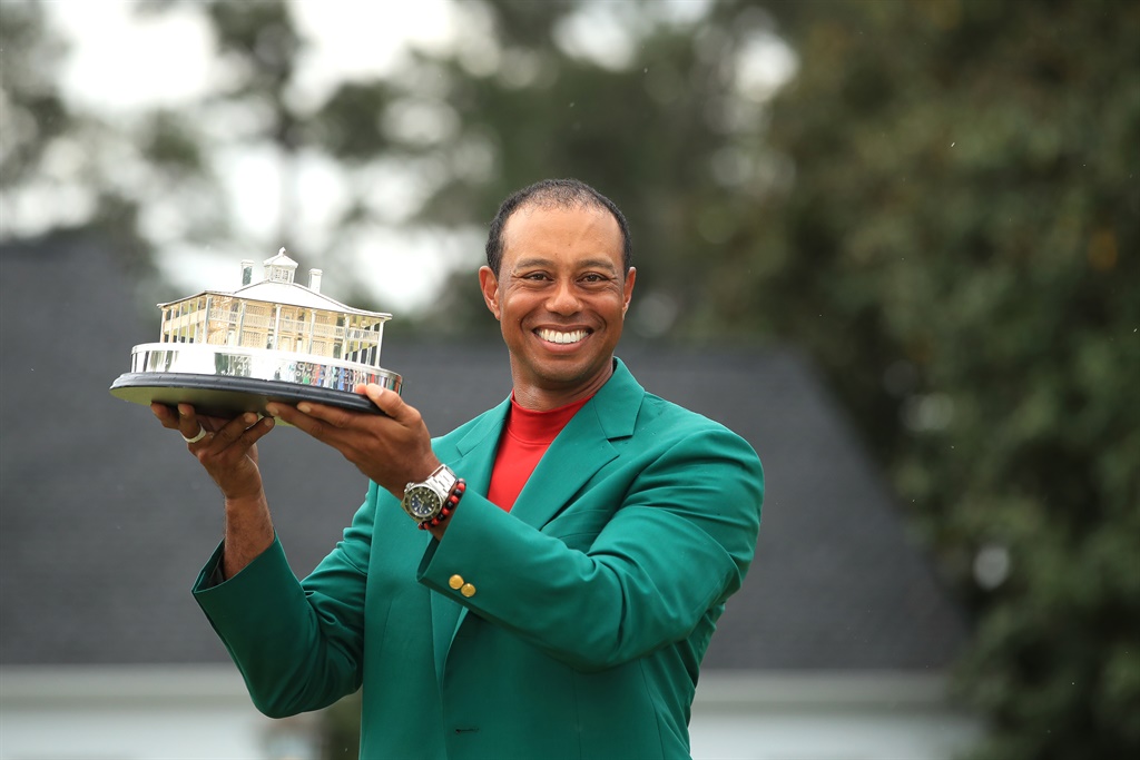 Tiger Woods of the United States celebrates with the Masters Trophy during the Green Jacket Ceremony after winning the Masters at Augusta National Golf Club on April 14, 2019 in Augusta, Georgia. (Photo by Andrew Redington/Getty Images)