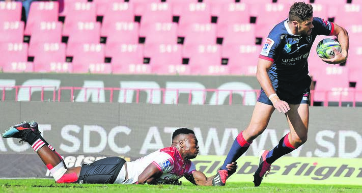 GRIPPING STUFF Wandisile Simelane of the Lions tackles Tom English of the Rebels during their Super Rugby match at Ellis Park Stadium yesterday. Picture: Gallo Images